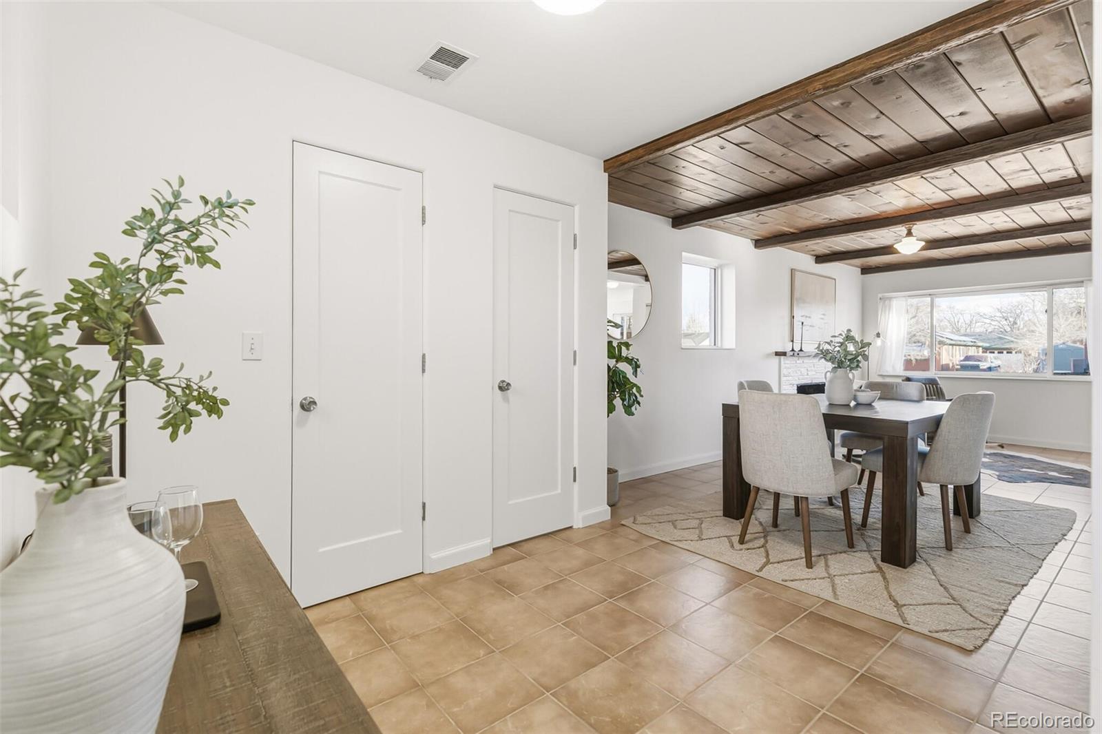 4535 Zephyr Street Wheat Ridge, CO 80033 - Photo 16 of 35 a view of a dining room with furniture