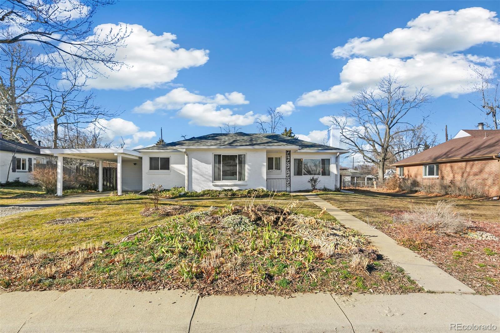 4535 Zephyr Street Wheat Ridge, CO 80033 - Photo 2 of 35 a front view of a house with a yard