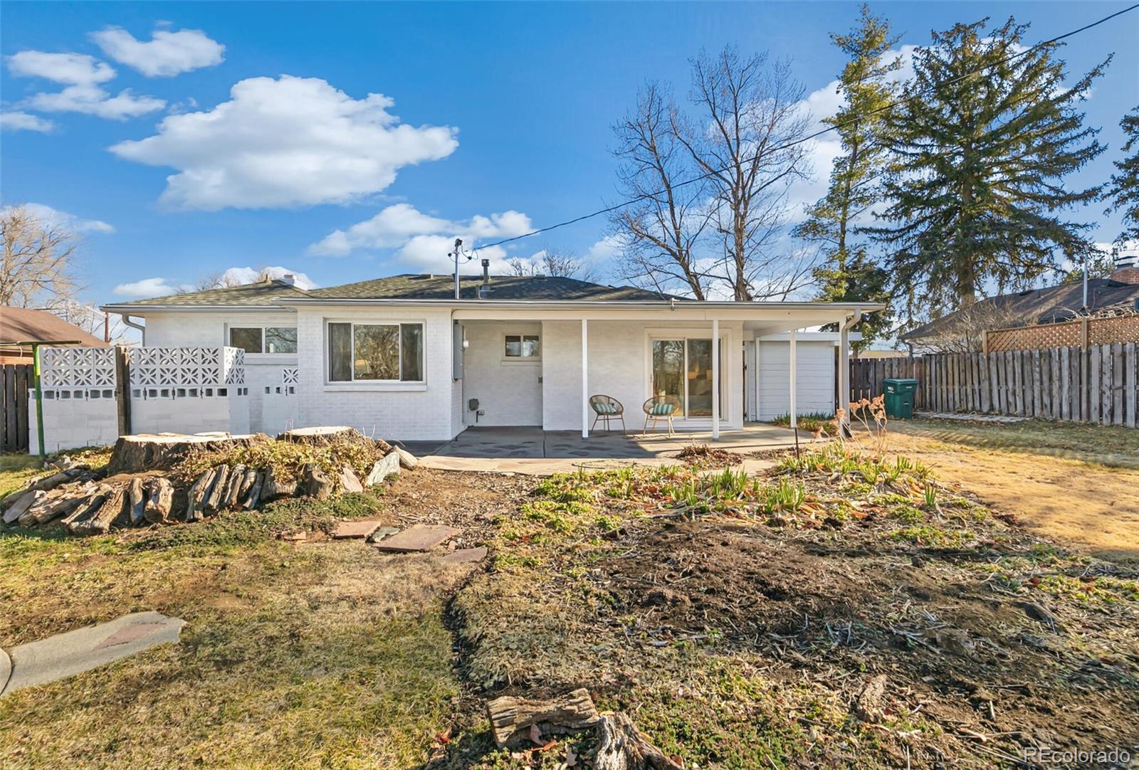 4535 Zephyr Street Wheat Ridge, CO 80033 - Photo 30 of 35 a view of large house with a large tree