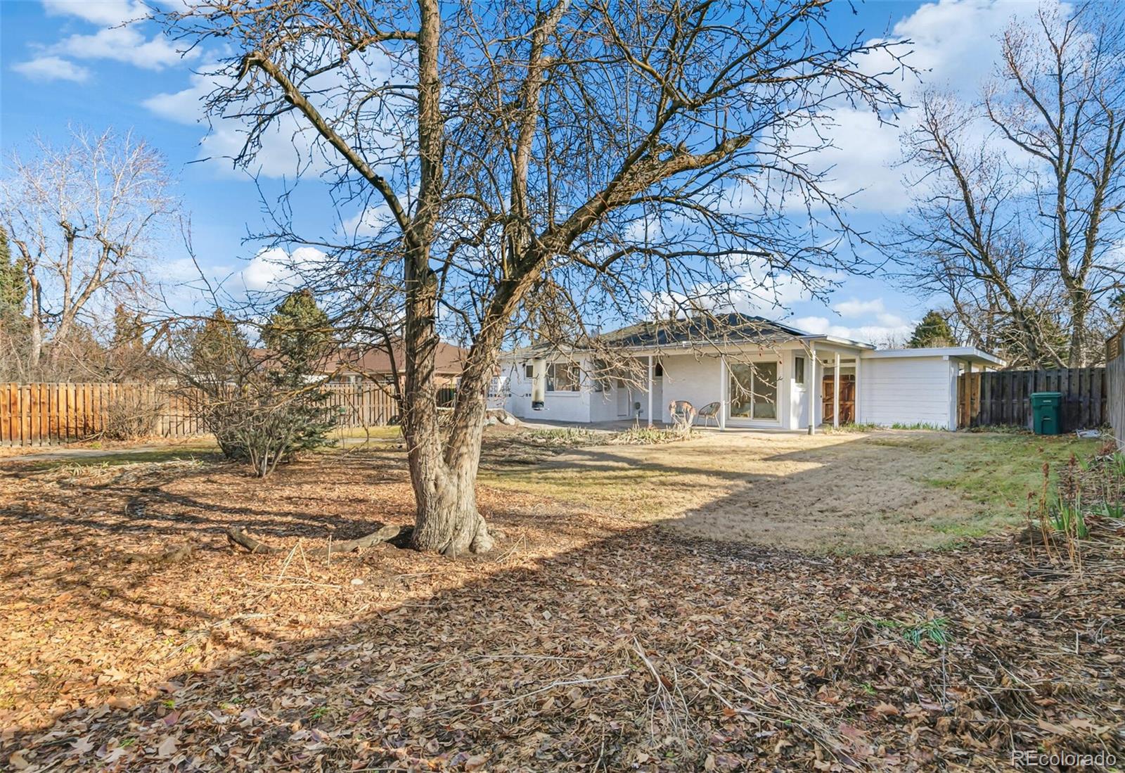 4535 Zephyr Street Wheat Ridge, CO 80033 - Photo 34 of 35 a front view of a house with a yard