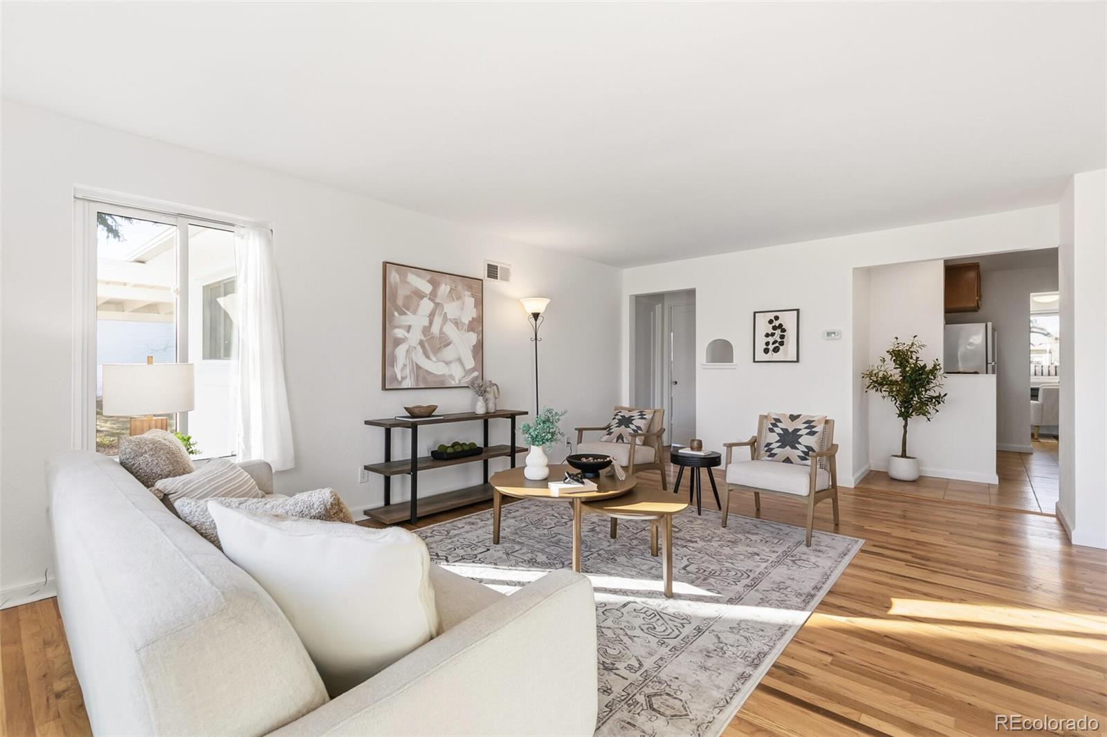 4535 Zephyr Street Wheat Ridge, CO 80033 - Photo 6 of 35 a living room with furniture and wooden floor