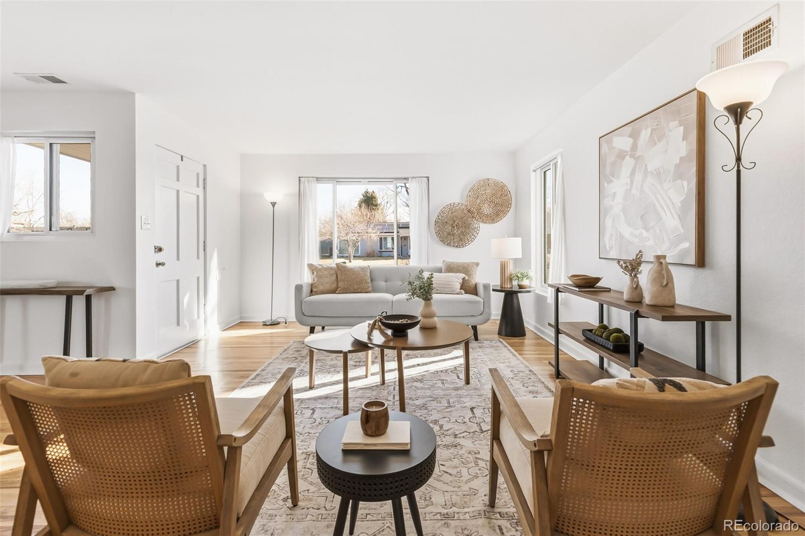 4535 Zephyr Street Wheat Ridge, CO 80033 - Photo 7 of 35 a living room with furniture and a large window