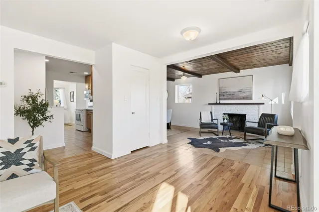 a view of a livingroom with furniture and a fireplace