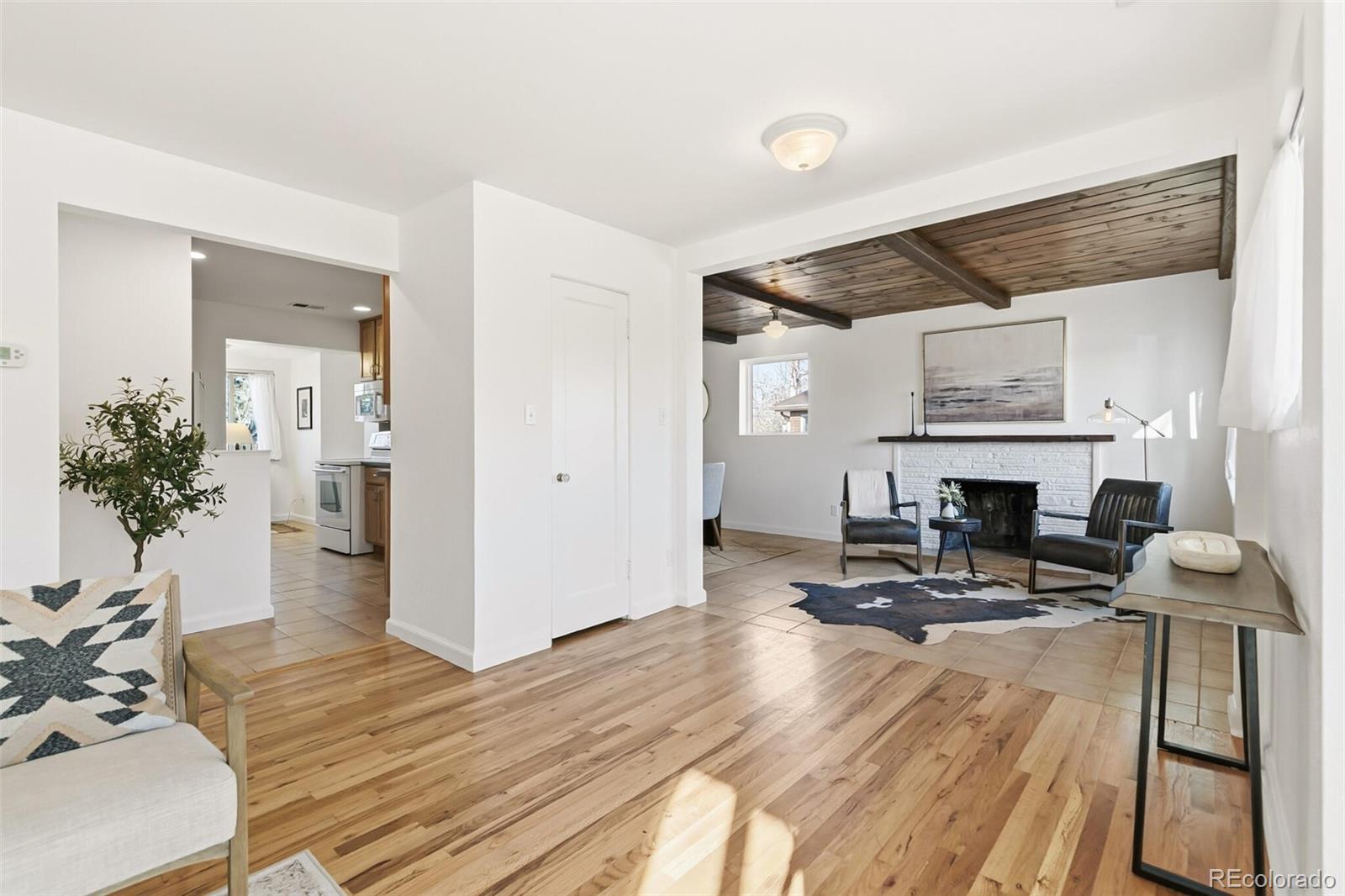4535 Zephyr Street Wheat Ridge, CO 80033 - Photo 9 of 35 a view of a livingroom with furniture and a fireplace