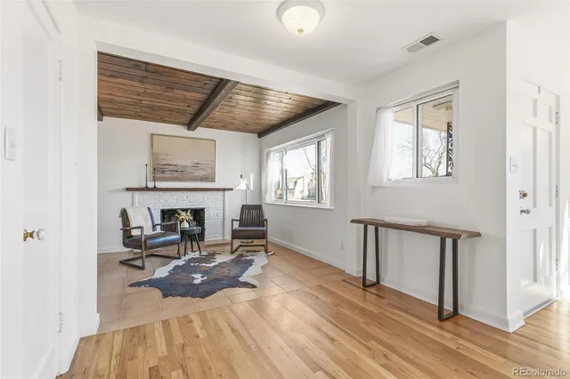 a bed room with furniture and a fireplace