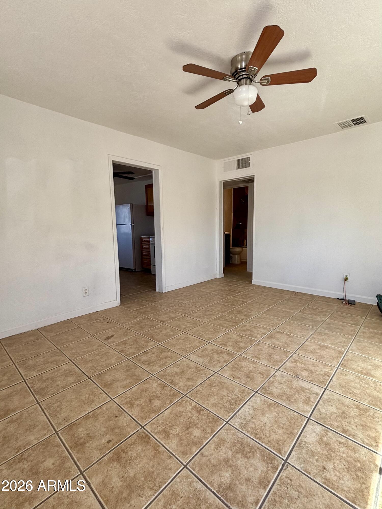 3036 West Almeria Road Phoenix, AZ 85009 - Photo 3 of 20 a view of an empty room