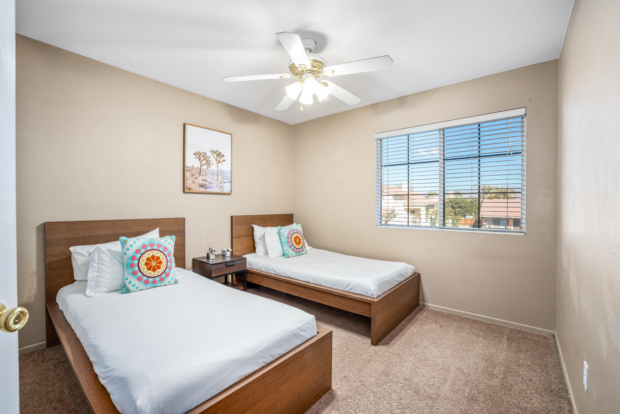 80721 Sycamore Lane Indio, CA 92201 - Photo 13 of 35 a bedroom with two beds and a window
