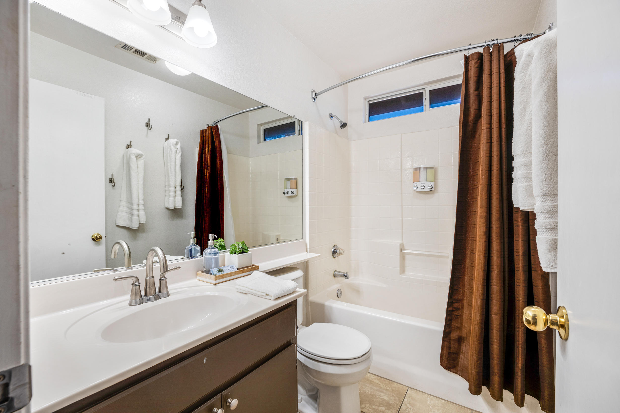 80721 Sycamore Lane Indio, CA 92201 - Photo 14 of 35 a bathroom with a sink a toilet and a large mirror