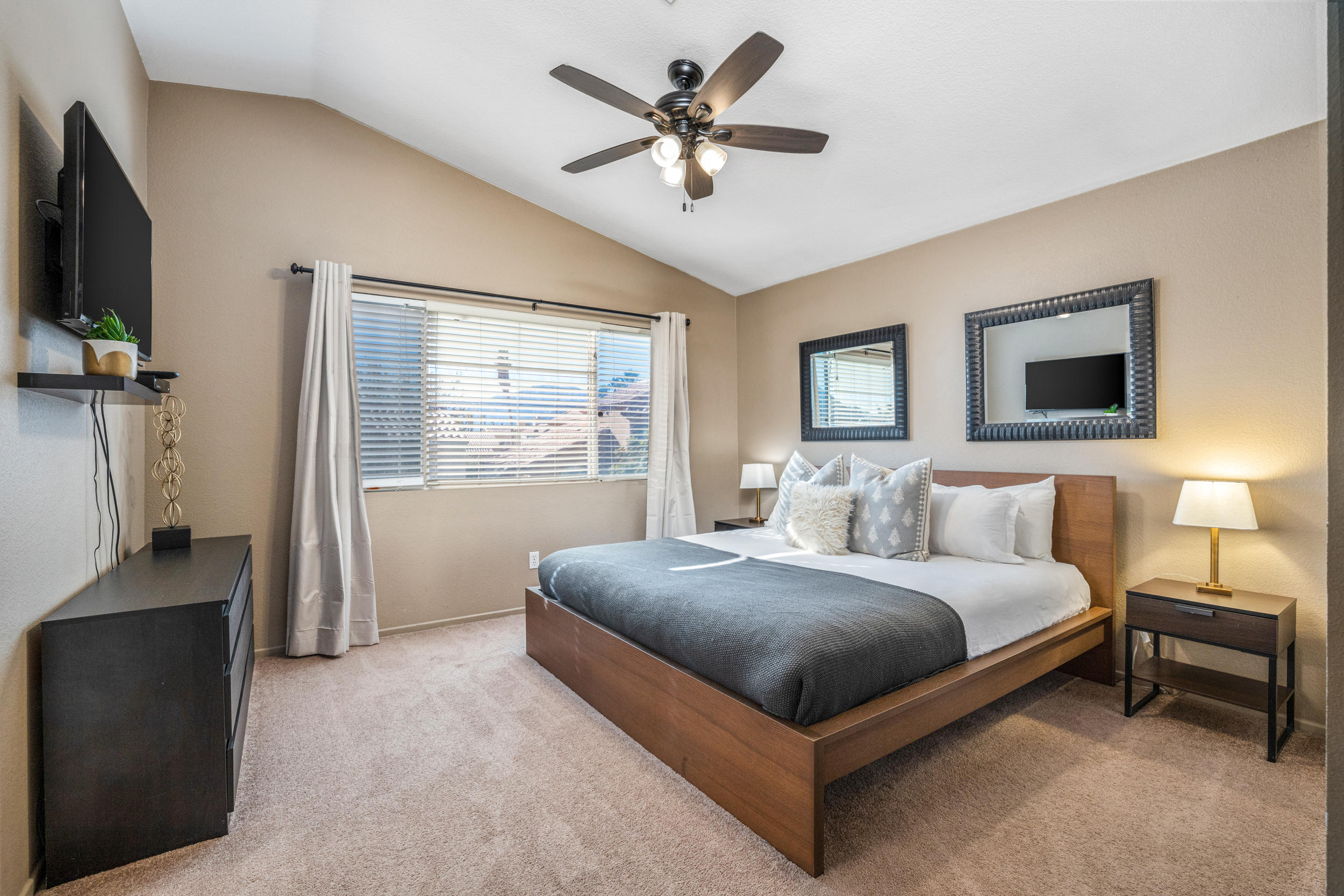 80721 Sycamore Lane Indio, CA 92201 - Photo 18 of 35 a bedroom with a bed and a flat screen tv