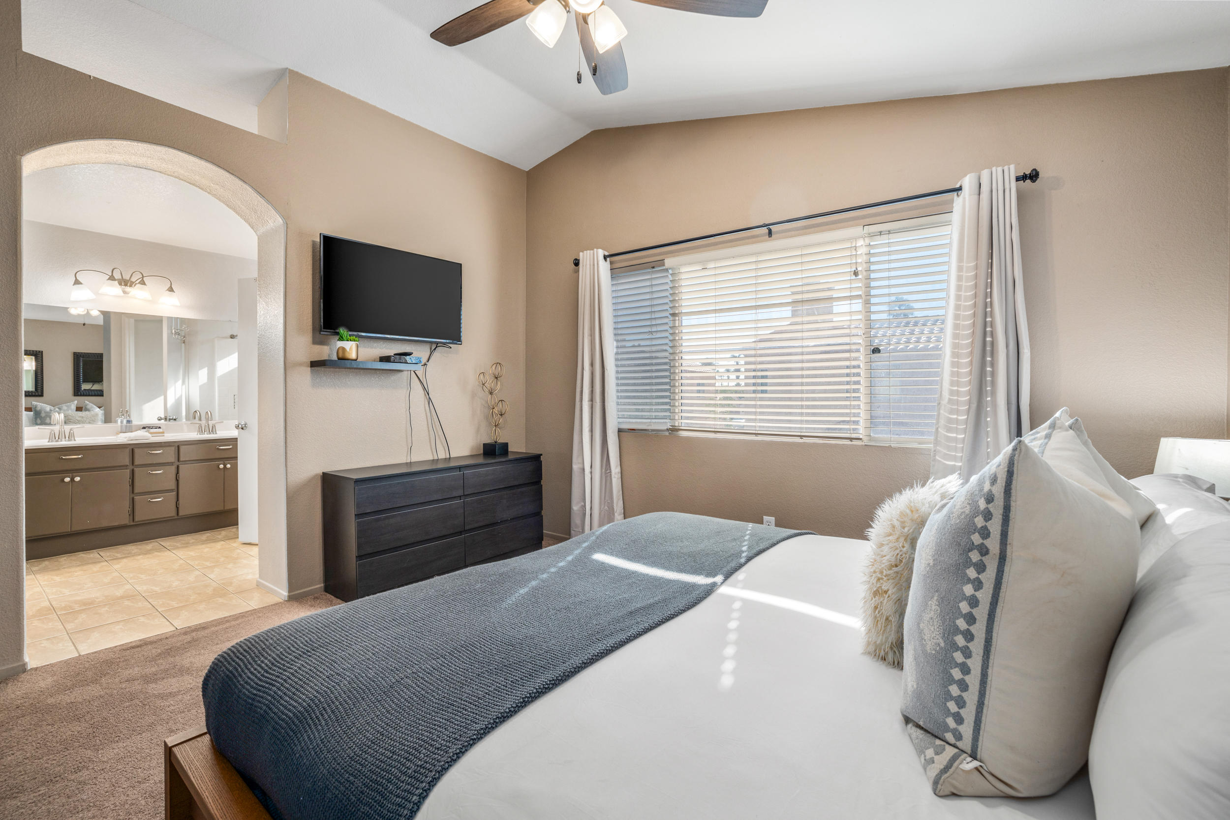80721 Sycamore Lane Indio, CA 92201 - Photo 19 of 35 a bedroom with a bed and a flat screen tv