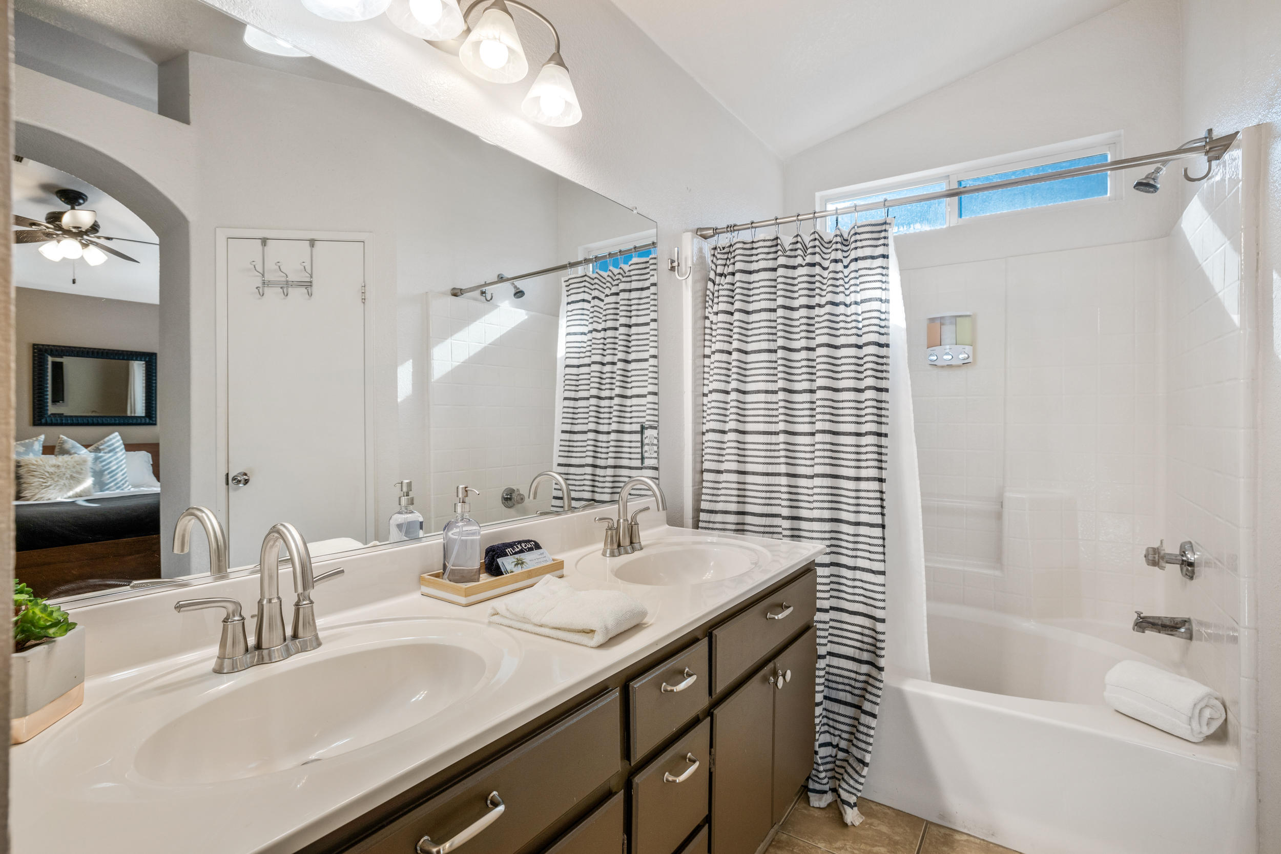 80721 Sycamore Lane Indio, CA 92201 - Photo 20 of 35 a bathroom with a tub sink and mirror