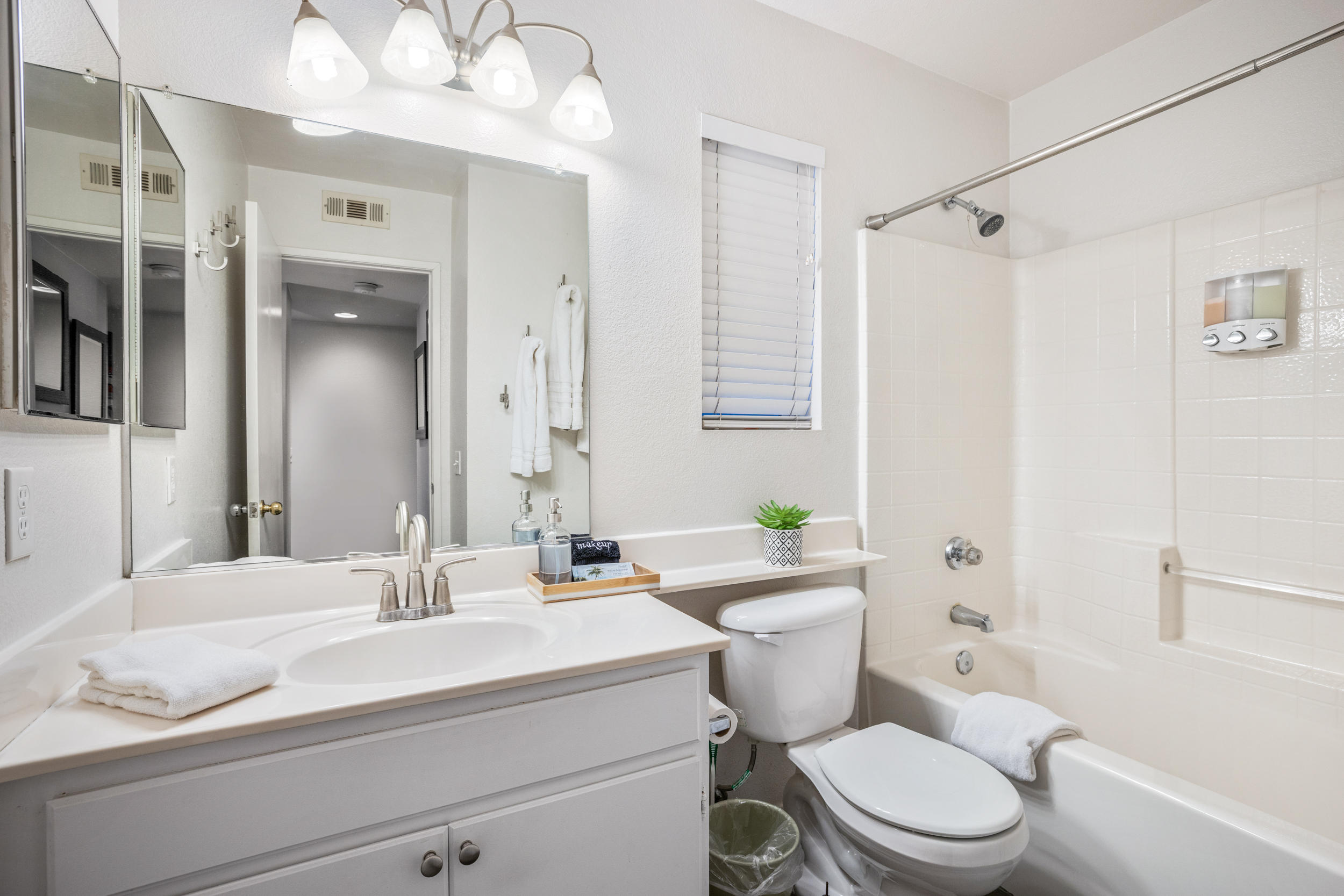 80721 Sycamore Lane Indio, CA 92201 - Photo 22 of 35 a bathroom with a sink a toilet a mirror and shower