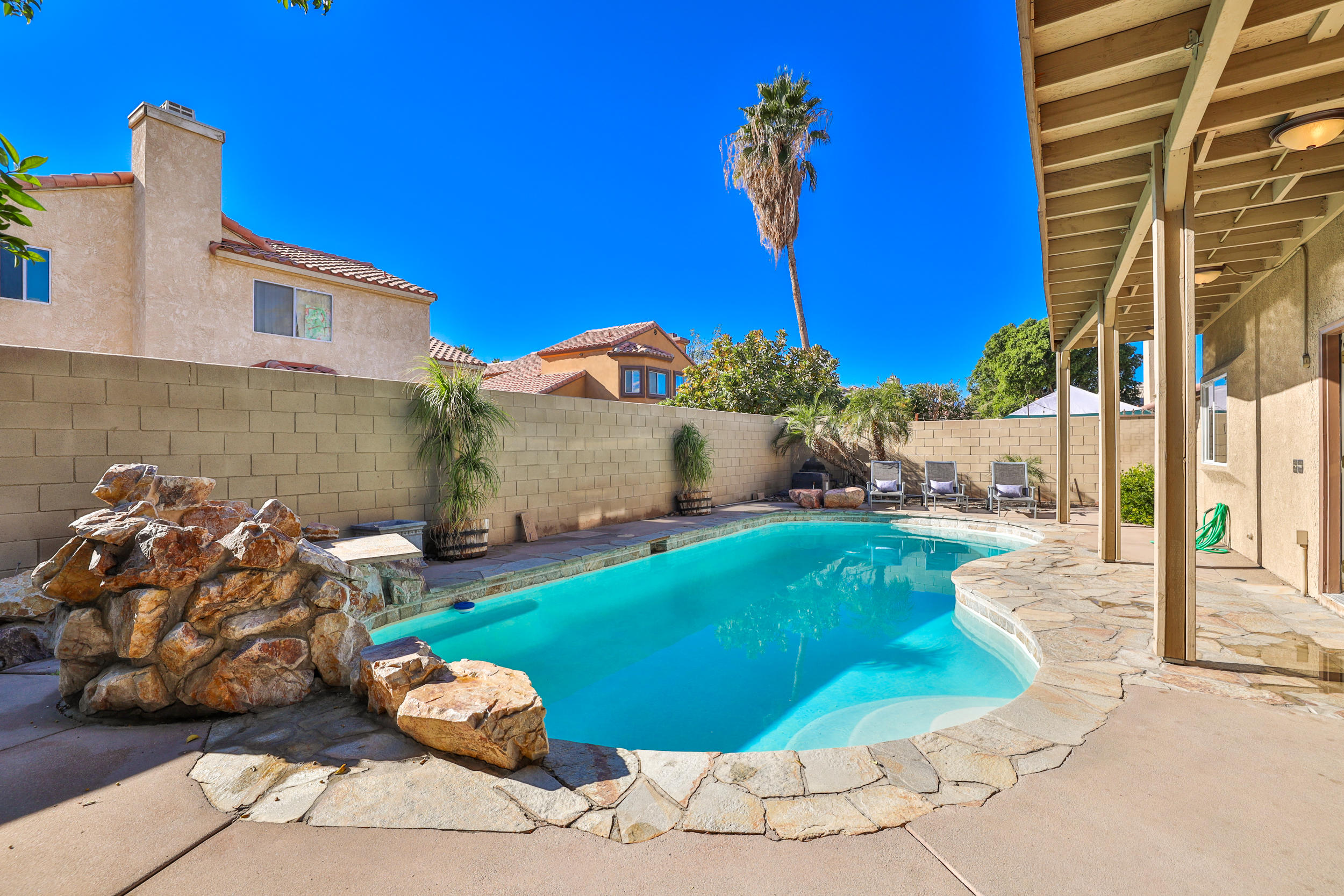 80721 Sycamore Lane Indio, CA 92201 - Photo 31 of 35 a front view of a house with garden