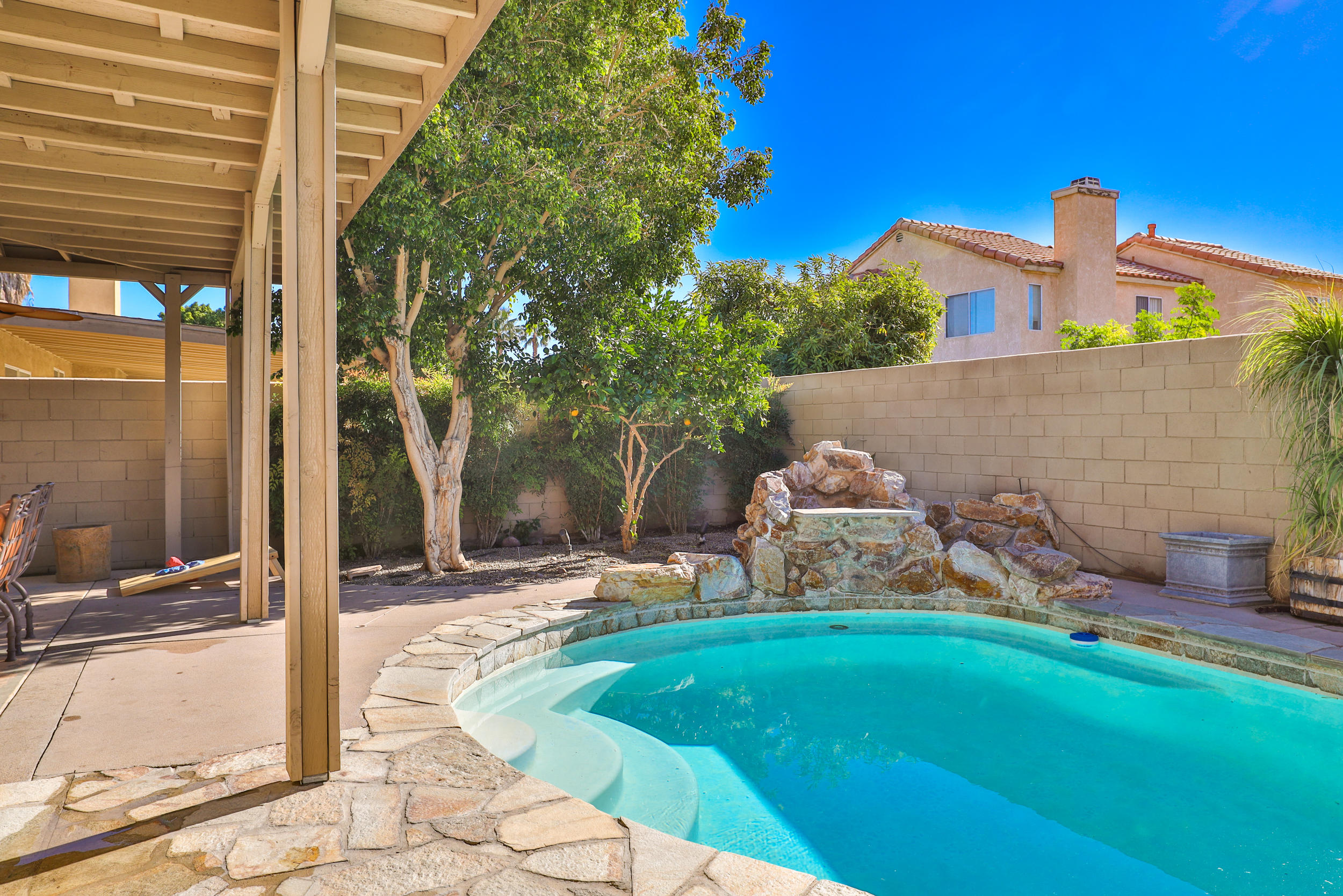80721 Sycamore Lane Indio, CA 92201 - Photo 34 of 35 a front view of a house with garden