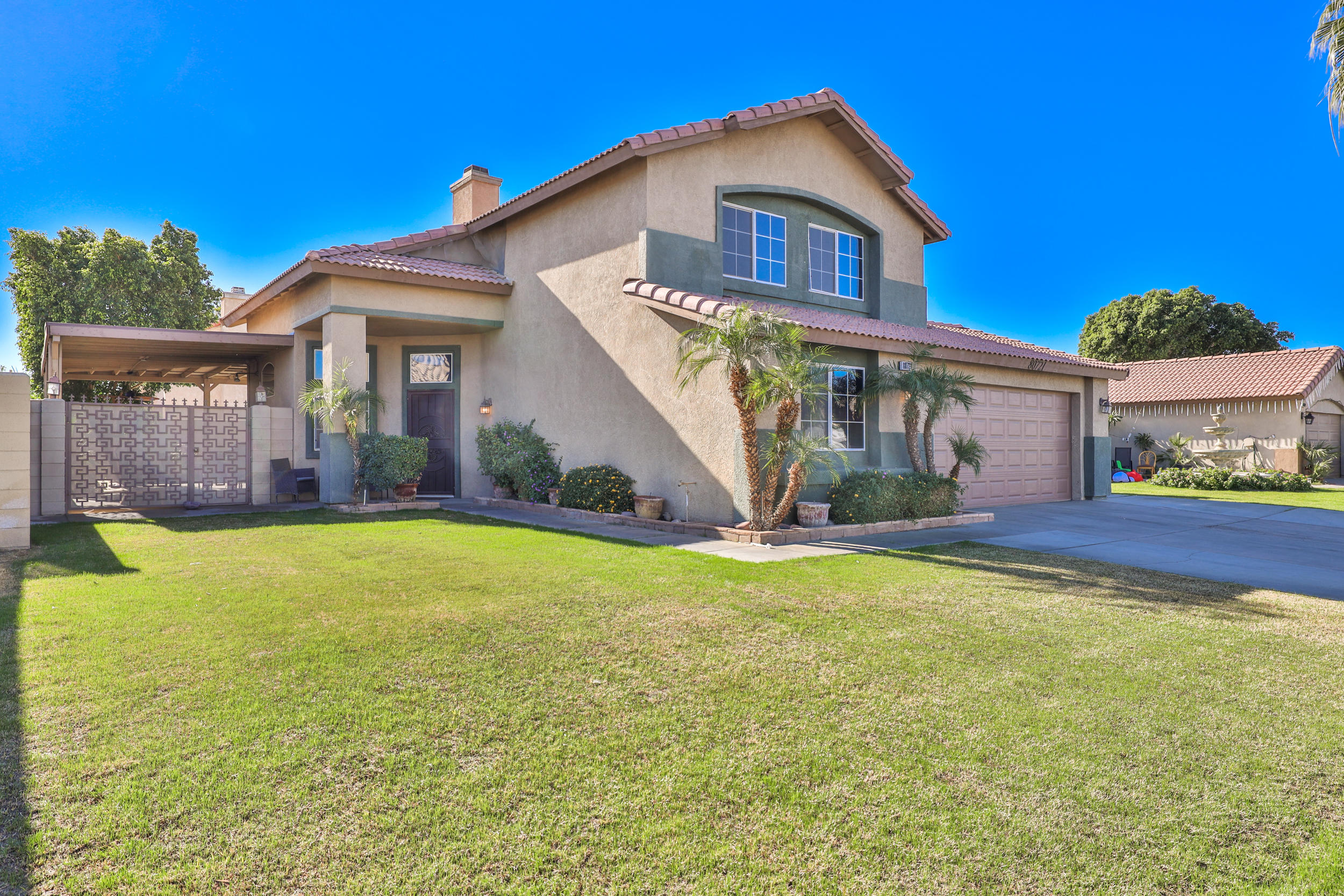 80721 Sycamore Lane Indio, CA 92201 - Photo 6 of 35 a front view of a house with a yard