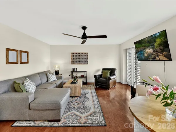 a living room with furniture or couch and a flat screen tv