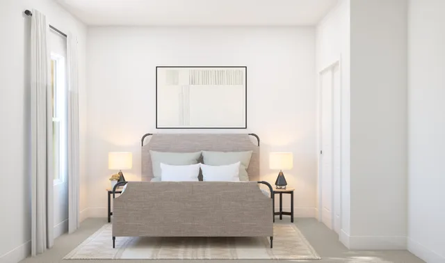 a bedroom with a bed and a mirror