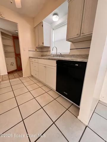 a kitchen with stainless steel appliances a sink and cabinets