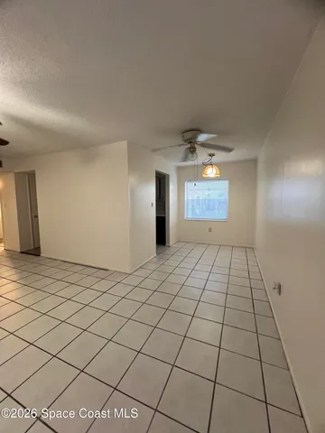 a view of an empty room and window