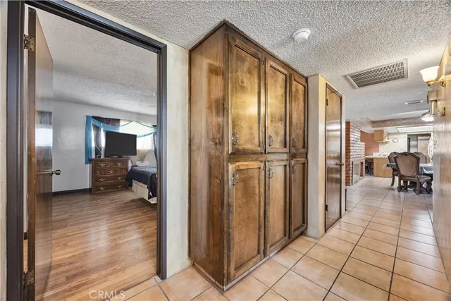 a bedroom with a large bed and a large window