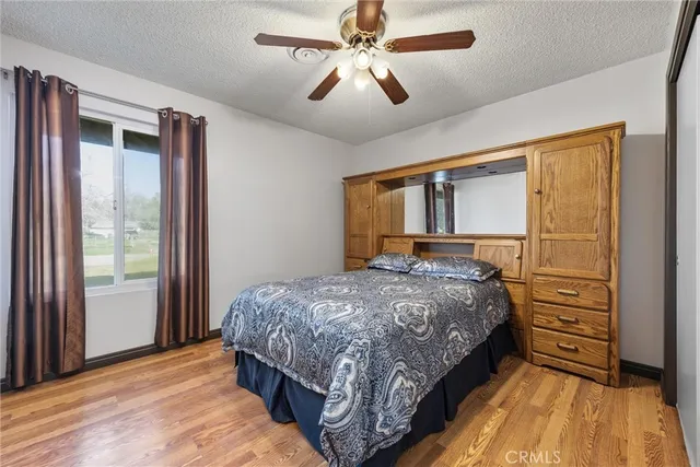 a view of room with window and a ceiling fan