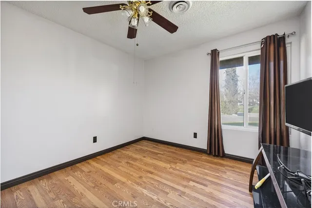 a living room with lots of furniture and gym equipment