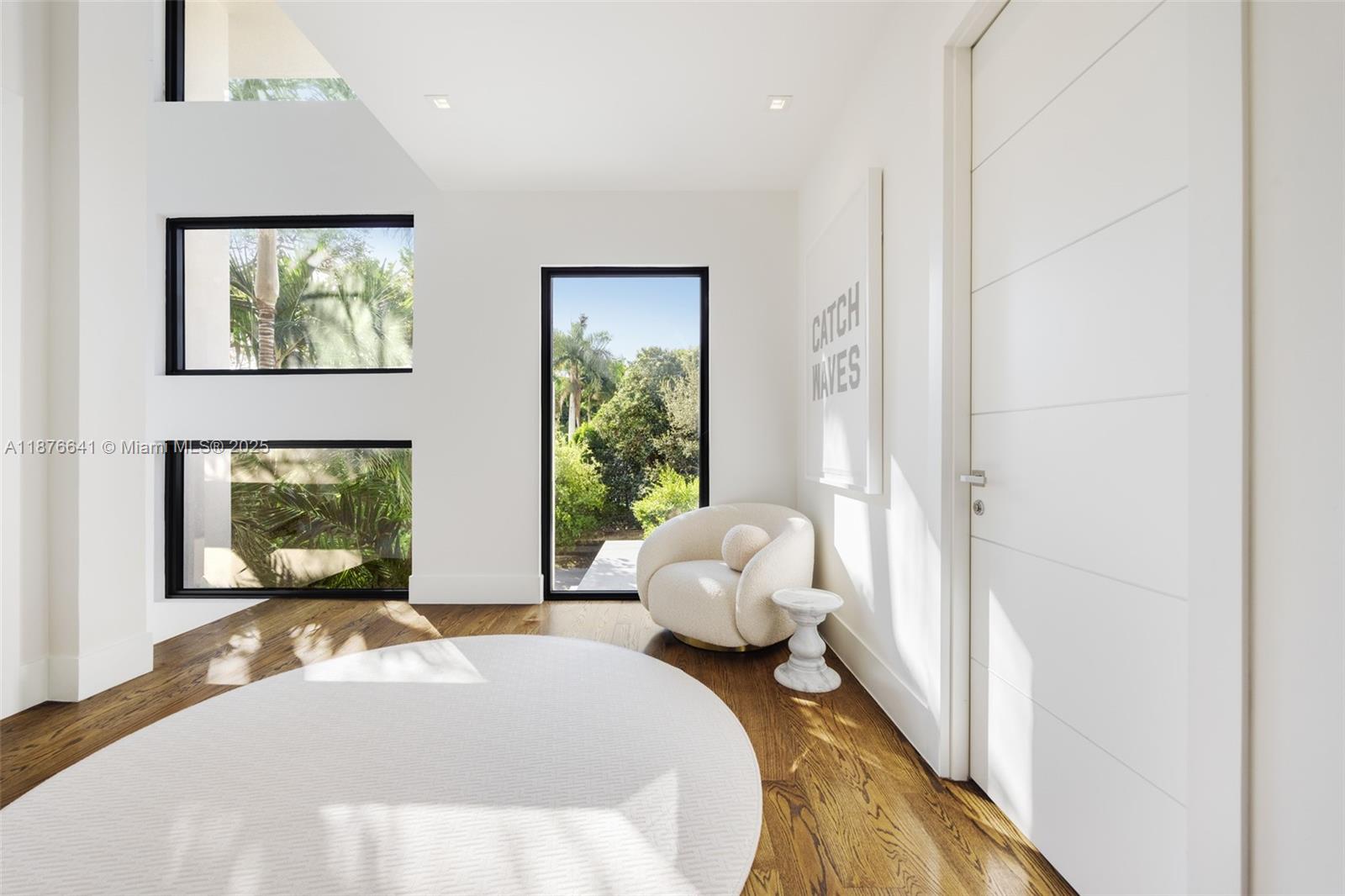 2321 Trapp Avenue Coconut Grove, FL 33133 - Photo 16 of 38 a bedroom with a bed and wooden floor