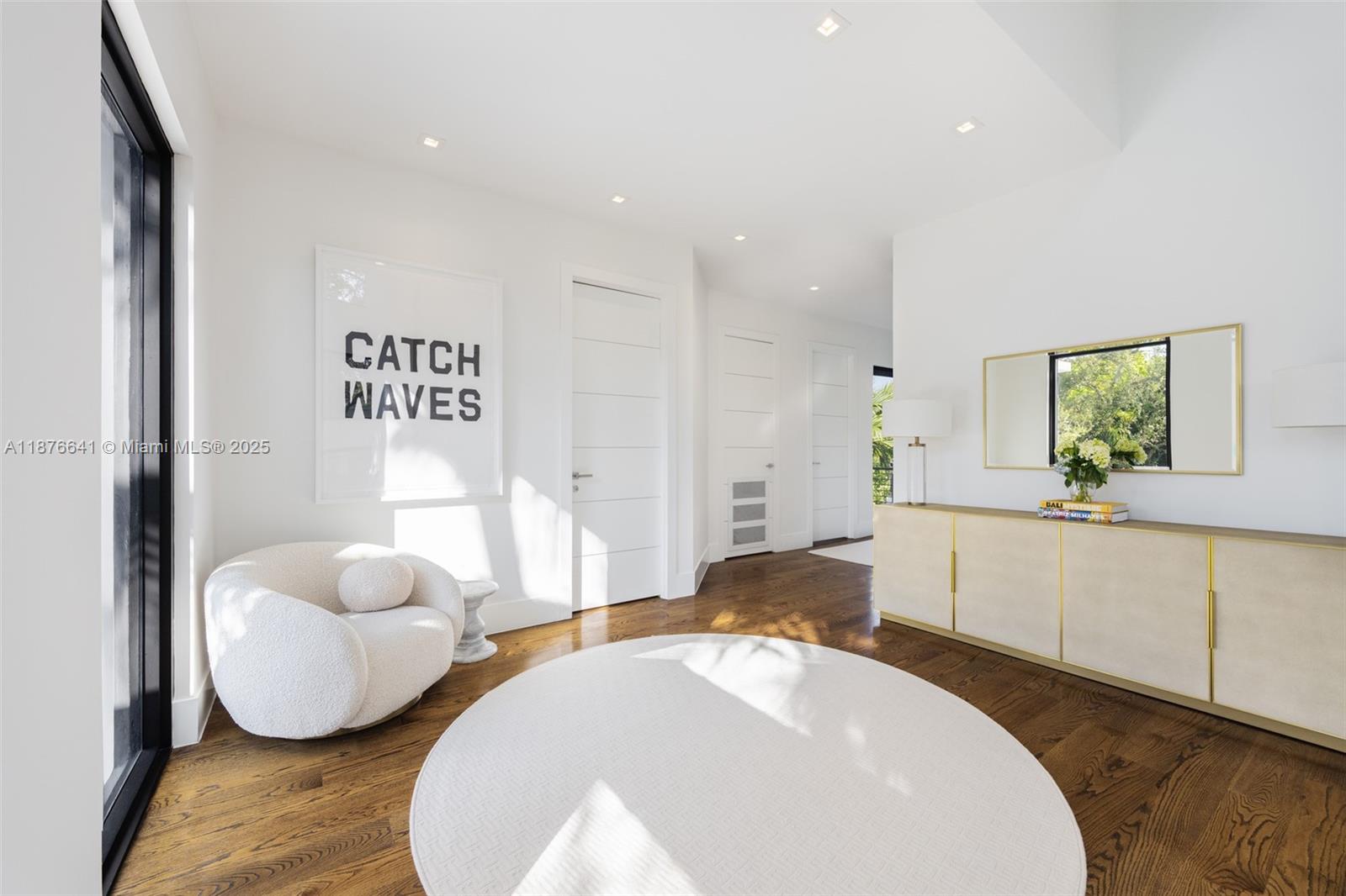 2321 Trapp Avenue Coconut Grove, FL 33133 - Photo 17 of 38 a spacious bedroom with a bed and a couch