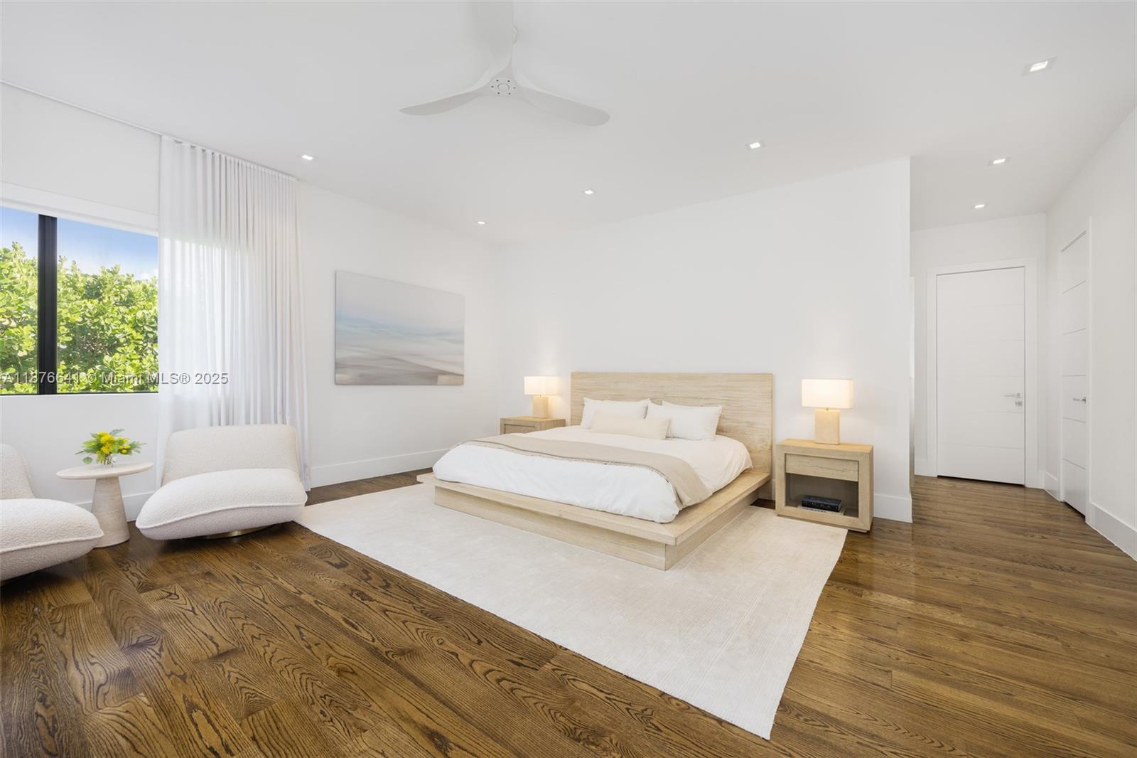 2321 Trapp Avenue Coconut Grove, FL 33133 - Photo 19 of 38 a spacious bedroom with a bed and a couch