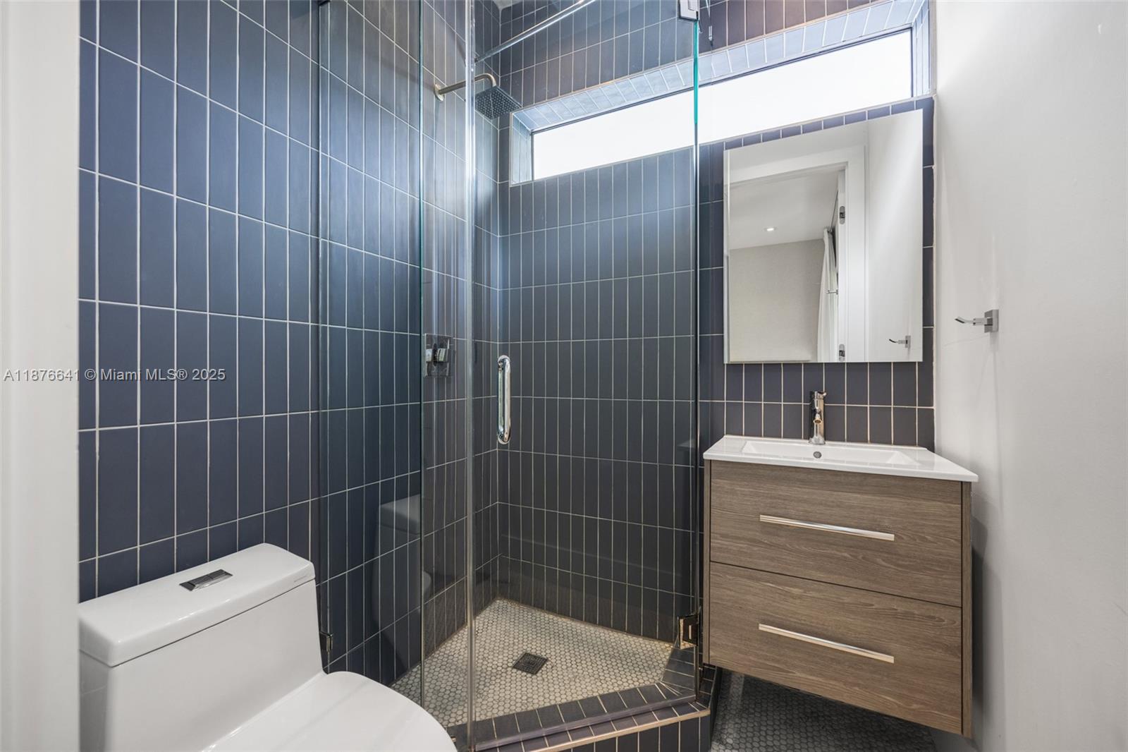 2321 Trapp Avenue Coconut Grove, FL 33133 - Photo 24 of 38 a bathroom with a toilet a sink and shower