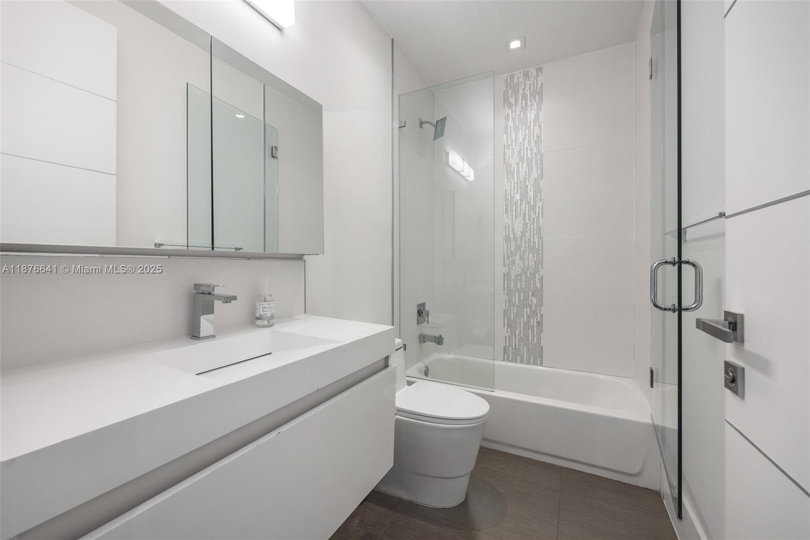 2321 Trapp Avenue Coconut Grove, FL 33133 - Photo 26 of 38 a bathroom with a bathtub shower sink vanity and toilet
