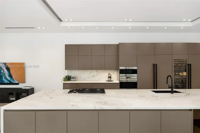 a kitchen with a sink and a refrigerator