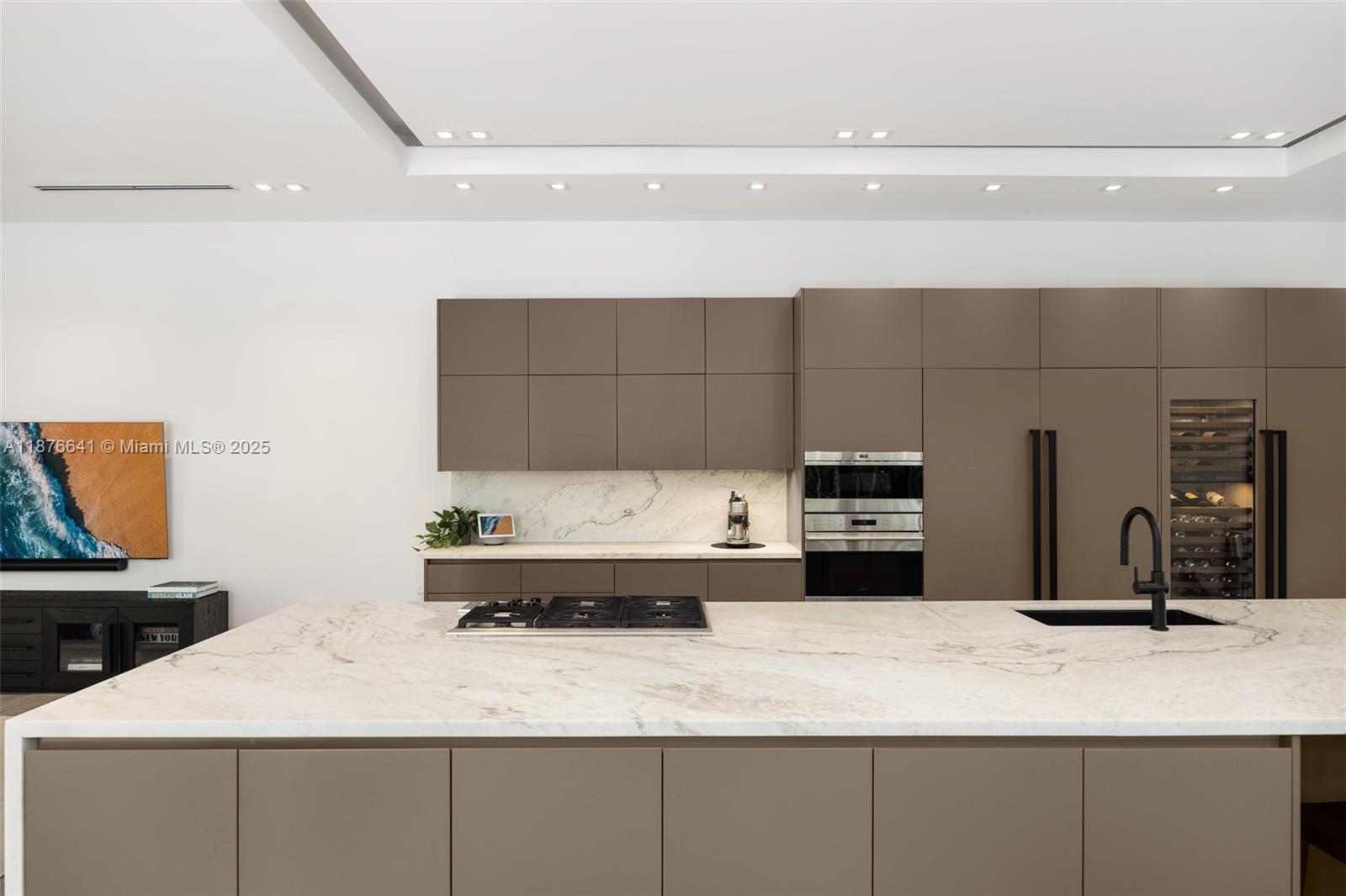 2321 Trapp Avenue Coconut Grove, FL 33133 - Photo 8 of 38 a kitchen with a sink and a refrigerator