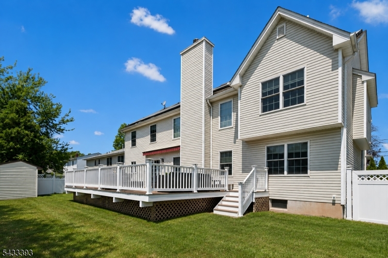 33 Stanton Street Clark, NJ 07066 - Photo 34 of 37 a view of a house with a yard and deck