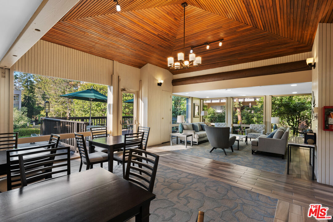 7202 Raintree Circle Culver City, CA 90230 - Photo 15 of 17 a view of a patio with dining table and chairs