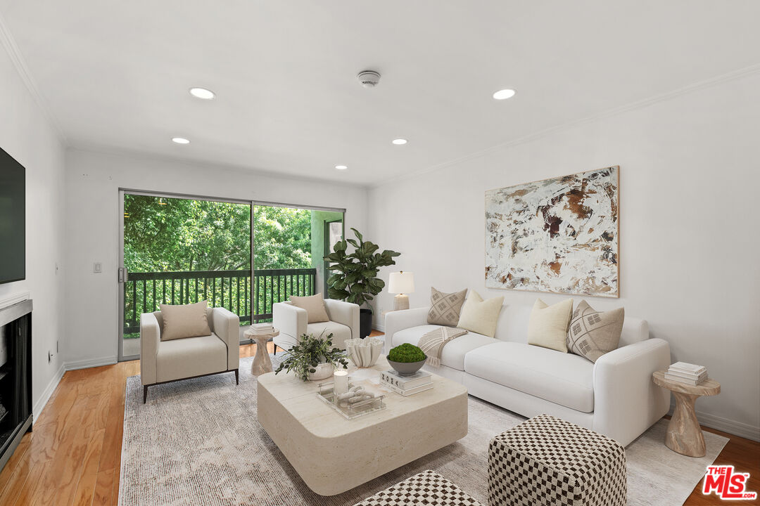 7202 Raintree Circle Culver City, CA 90230 - Photo 2 of 17 a living room with furniture and a large window