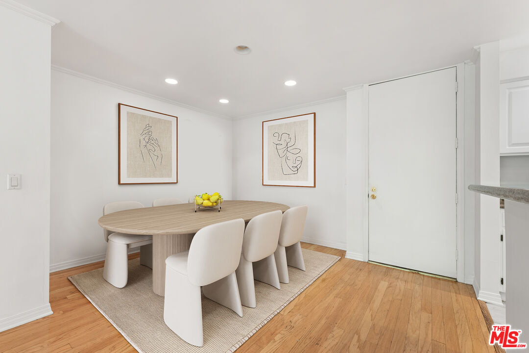 7202 Raintree Circle Culver City, CA 90230 - Photo 3 of 17 a view of a dining room with furniture and wooden floor