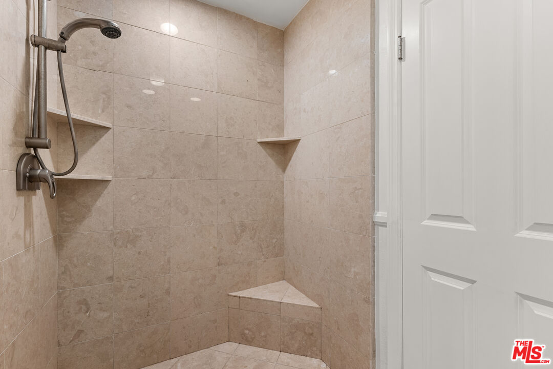 7202 Raintree Circle Culver City, CA 90230 - Photo 8 of 17 a bathroom with a shower and toilet