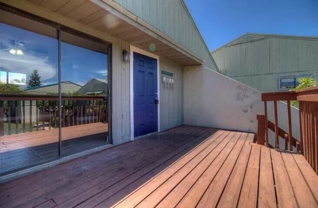 a view of balcony with wooden floor