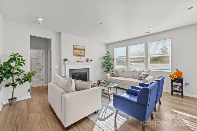 a living room with lots of furniture and a window