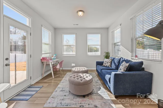 a view of livingroom with furniture and windows