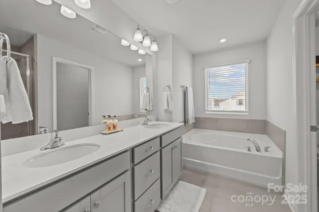 a bathroom with a bathtub and a shower