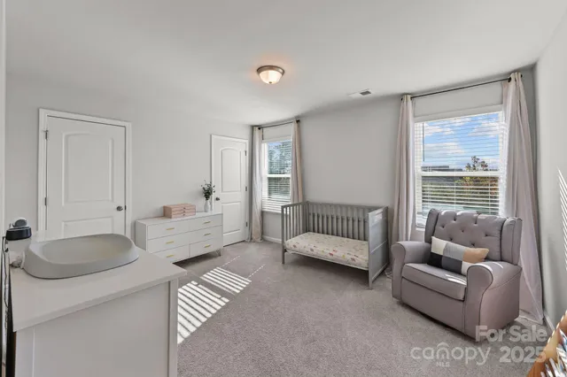 a bathroom with a double vanity sink mirror and toilet