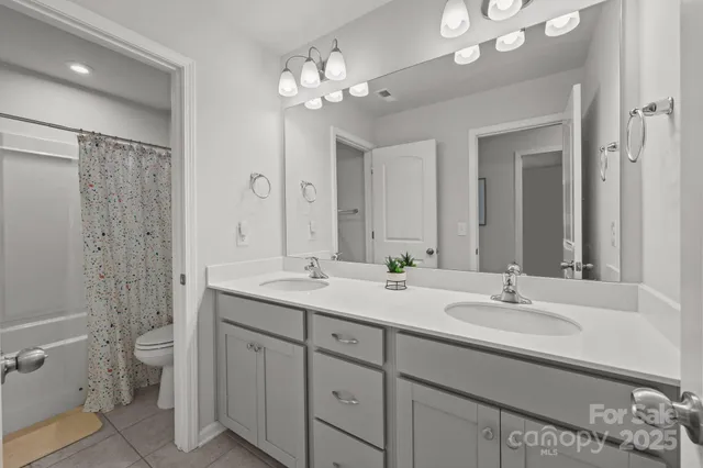 a bathroom with a toilet and shower