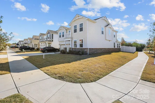 an aerial view of a residential houses with city view
