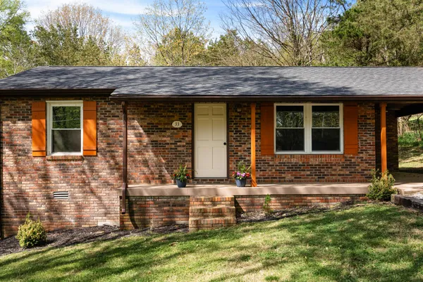 front view of a house with a yard