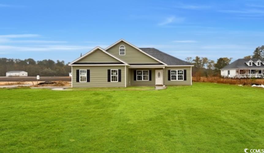 1170 Justice Loop Loris, SC 29569 - Photo 1 of 2 Rear view of property featuring a lawn
