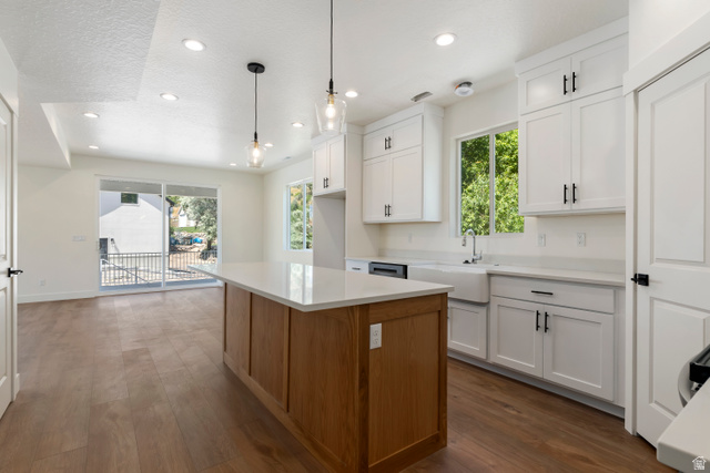 504 North 650 E Street Springville, UT 84663 - Photo 7 of 36 Kitchen featuring a wood-finish island with a light-colored countertop, white shaker-style cabinetry, and a farmhouse sink