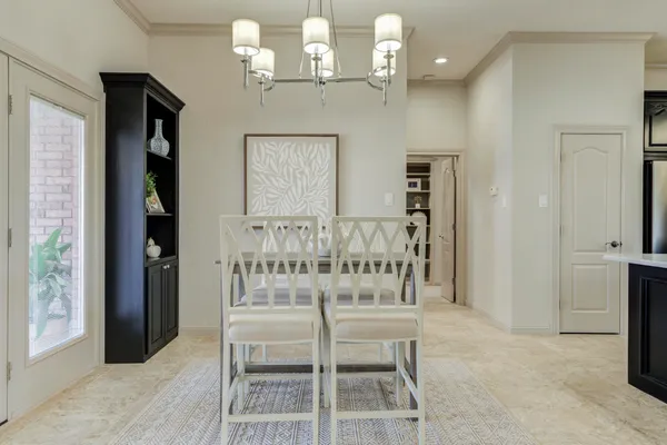 a kitchen with a sink cabinets and window