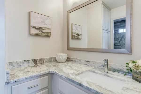 a view of an house with swimming pool and sitting area